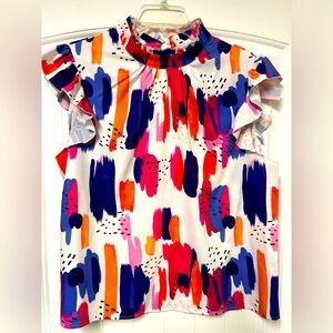 Women’s dress tank with ruffled sleeve cap.